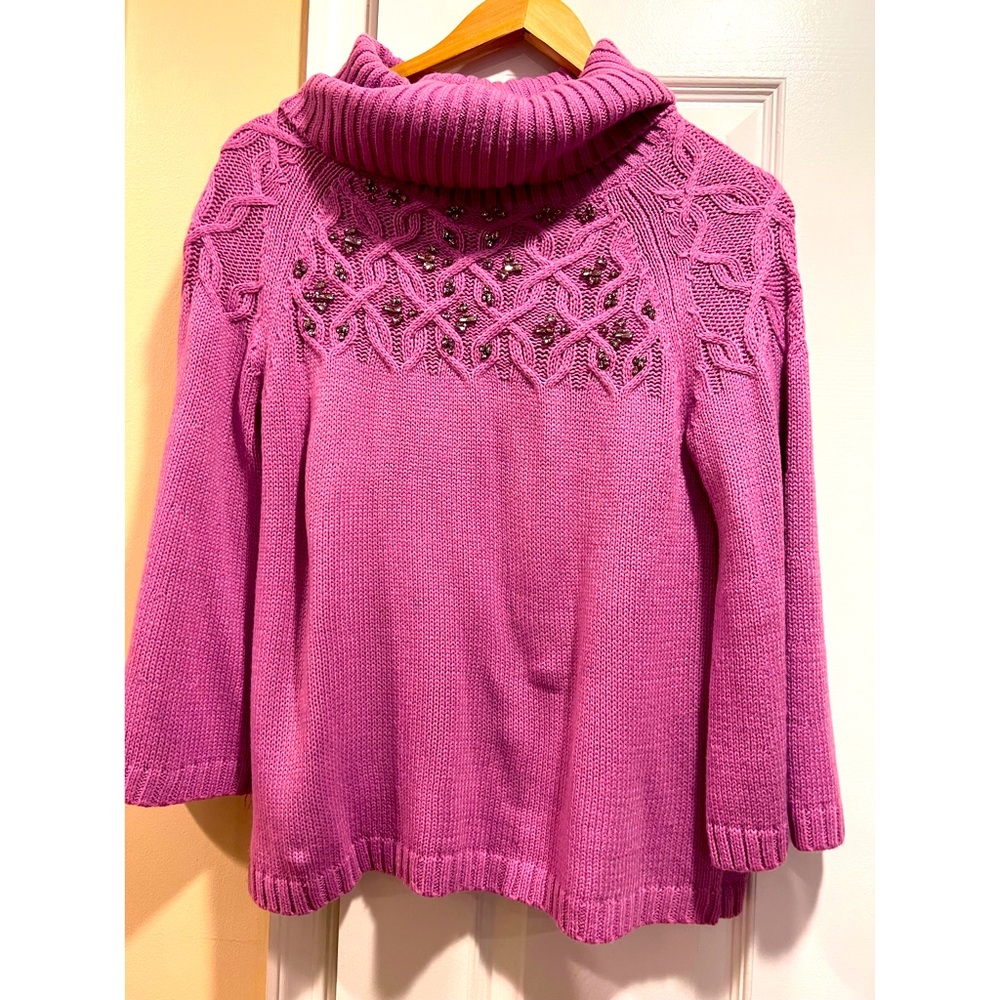 New York & company’s cowl neck sweater with rhinestones.